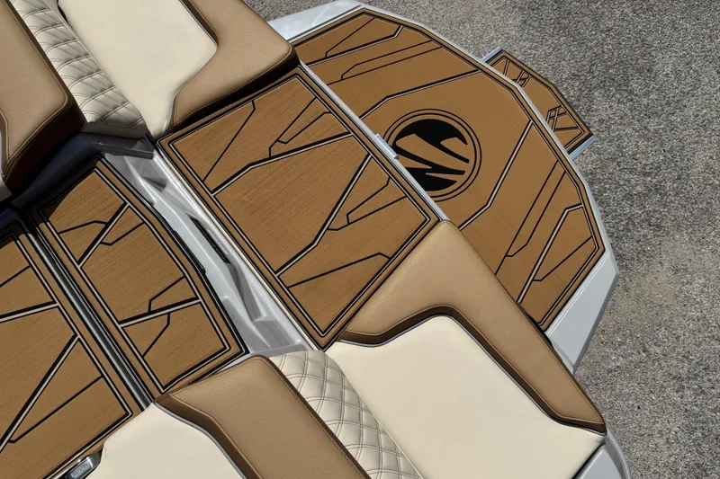 Slide: The Image of 2026 Tigé 24RZX boat interior with tan and cream seating, geometric design. - 10
