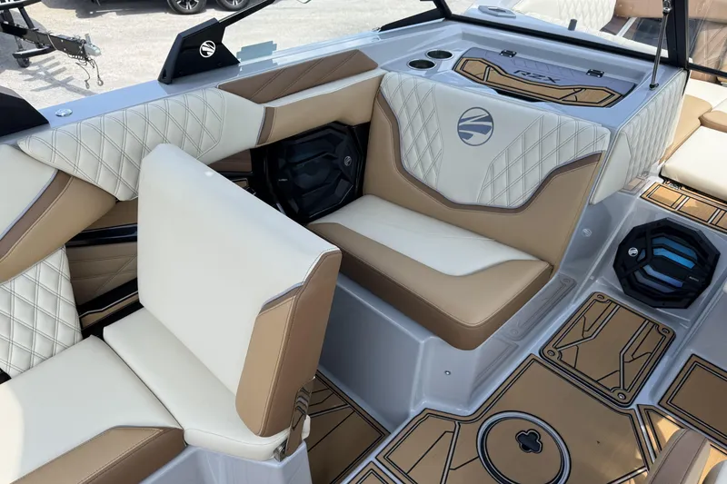 Slide: The Image of 2026 Tigé 24RZX boat interior with luxurious tan and white seating, modern design. - 12
