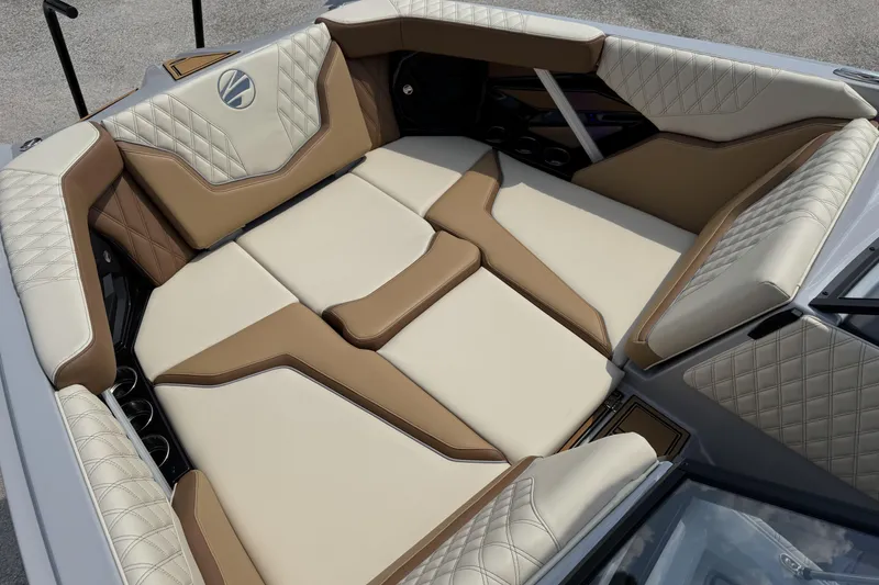Slide: The Image of 2026 Tigé 24RZX boat interior with luxurious tan and cream seating. - 13