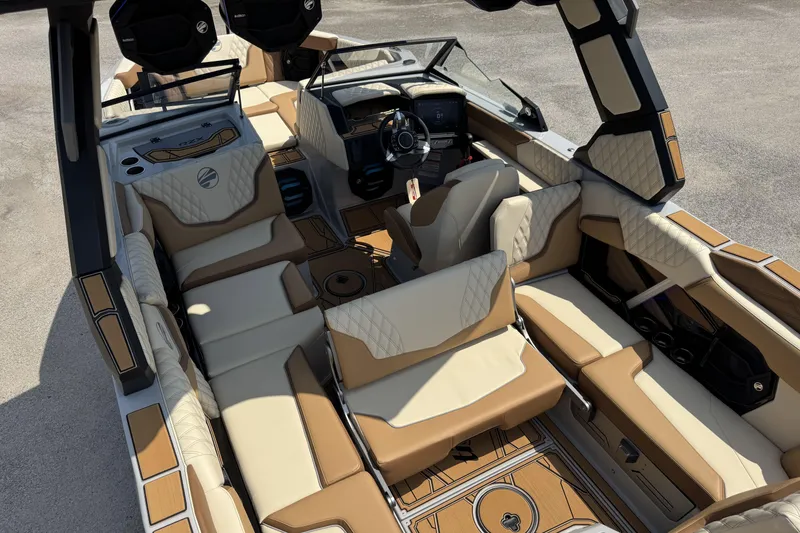 Slide: The Image of 2026 Tigé 24RZX boat interior with luxurious tan and cream seating, advanced dashboard. - 15