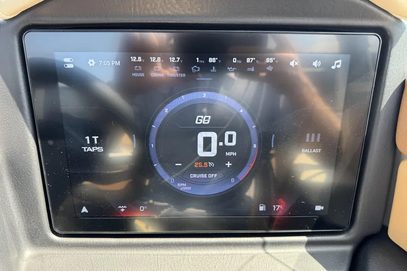 Slide: The Image of Dashboard display of 2026 Tigé 24RZX boat showing speed, ballast, and system status. - 16
