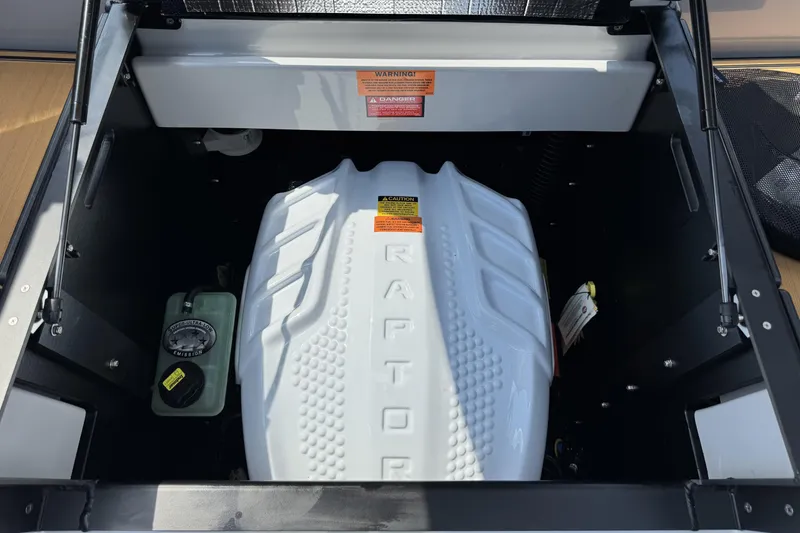 Slide: The Image of 2026 Tigé 24RZX boat engine compartment with Raptor engine cover. - 17