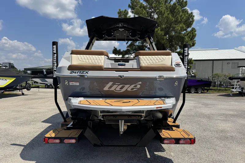Slide: The Image of 2026 Tigé 24RZX boat rear view, showcasing sleek design and spacious seating. - 3