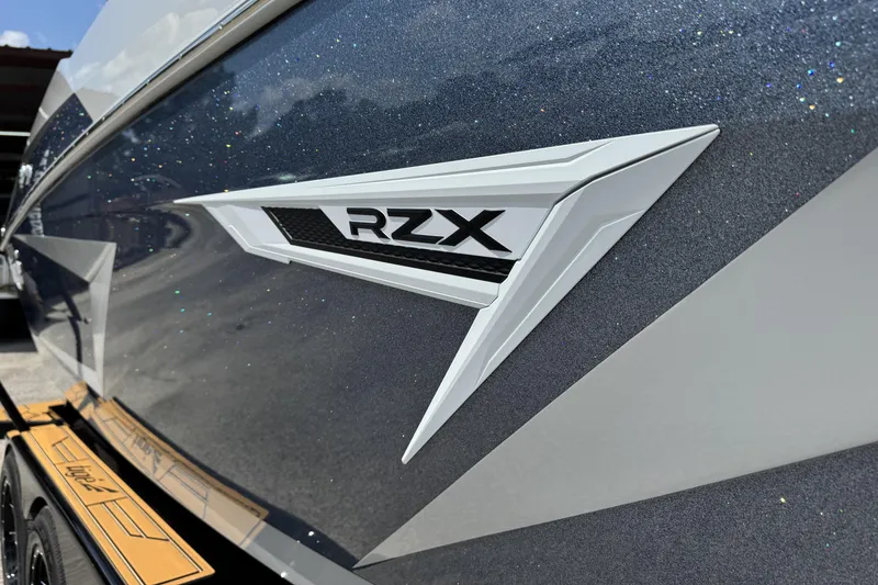Slide: The Image of 2026 Tigé 24RZX boat with sleek design and RZX logo detail. - 6