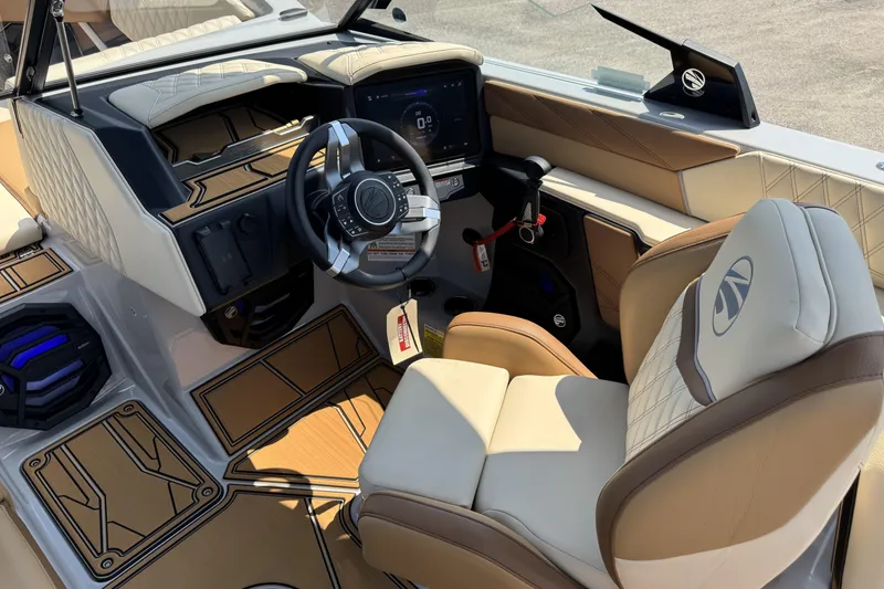 Slide: The Image of 2026 Tigé 24RZX boat interior with modern dashboard and luxurious seating. - 7