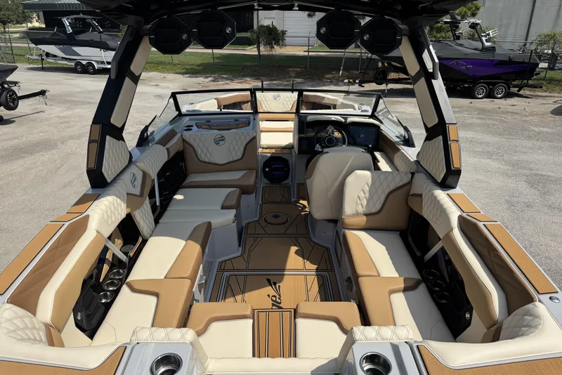 Slide: The Image of 2026 Tigé 24RZX boat interior with luxurious tan and white seating, advanced dashboard. - 8
