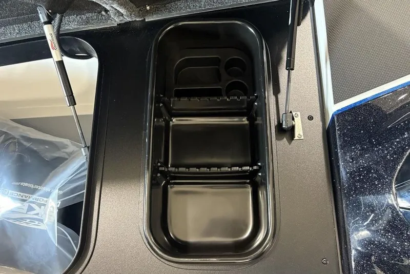Slide: The Image of 2026 Skeeter FXR20 FLEX boat storage compartment with hydraulic lift supports. - 12