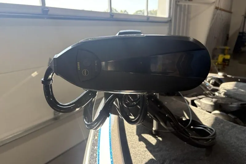 Slide: The Image of 2026 Skeeter FXR20 FLEX boat component in a sunlit garage setting. - 13