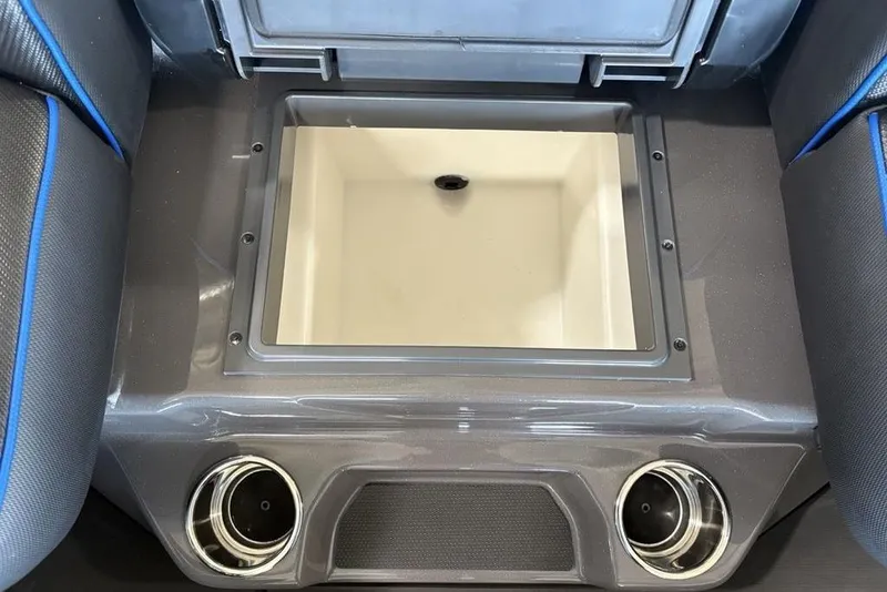 Slide: The Image of 2026 Skeeter FXR20 FLEX boat interior with storage compartment and cup holders. - 14