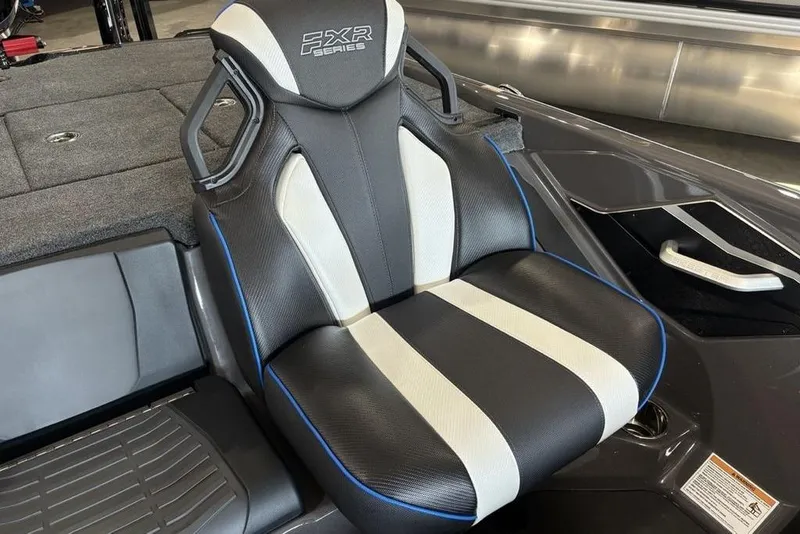 Slide: The Image of 2026 Skeeter FXR20 FLEX boat seat, black and white design with blue accents. - 15
