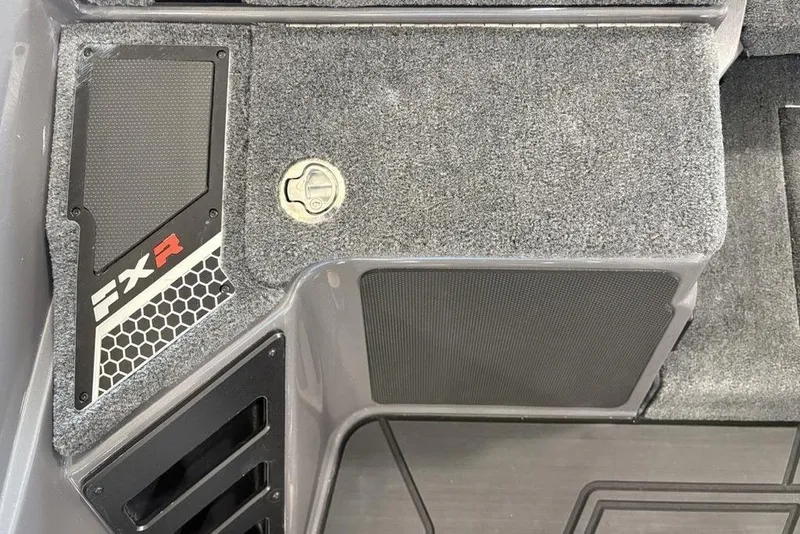 Slide: The Image of 2026 Skeeter FXR20 FLEX boat interior with textured flooring and FXR branding. - 17
