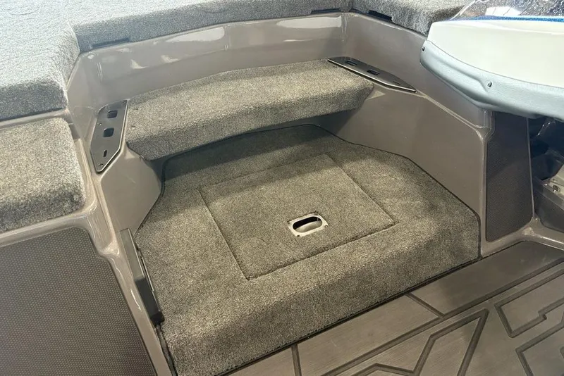 Slide: The Image of 2026 Skeeter FXR20 FLEX boat interior with carpeted storage compartment. - 18