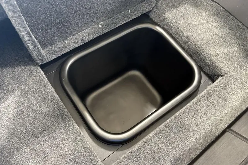 Slide: The Image of 2026 Skeeter FXR20 FLEX boat storage compartment with carpeted interior. - 19