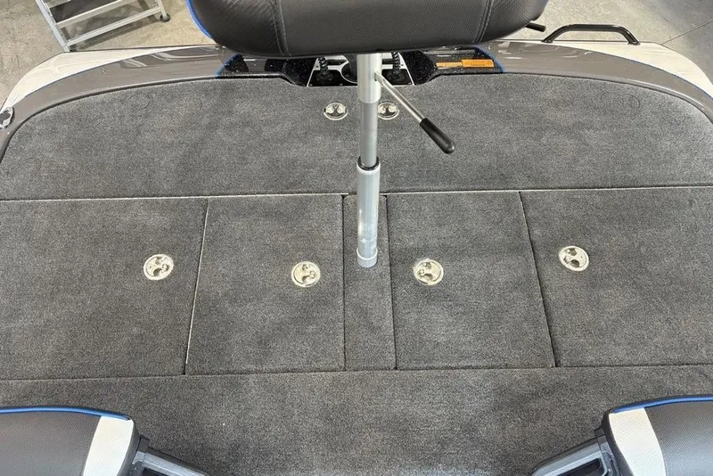 Slide: The Image of 2026 Skeeter FXR20 FLEX boat deck with storage compartments and seat post. - 26