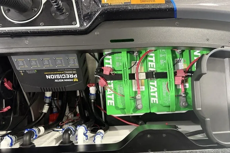 Slide: The Image of 2026 Skeeter FXR20 FLEX boat battery compartment with Minn Kota Precision charger. - 28