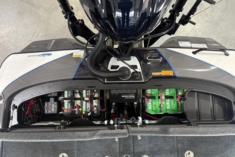 Slide: The Image of 2026 Skeeter FXR20 FLEX boat engine compartment with batteries and wiring. - 30