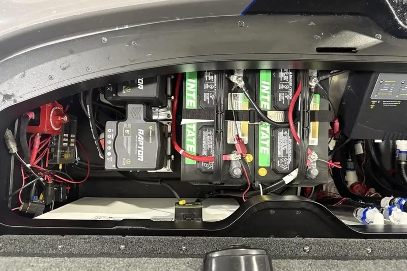 Slide: The Image of 2026 Skeeter FXR20 FLEX boat battery compartment with Interstate batteries and wiring. - 34