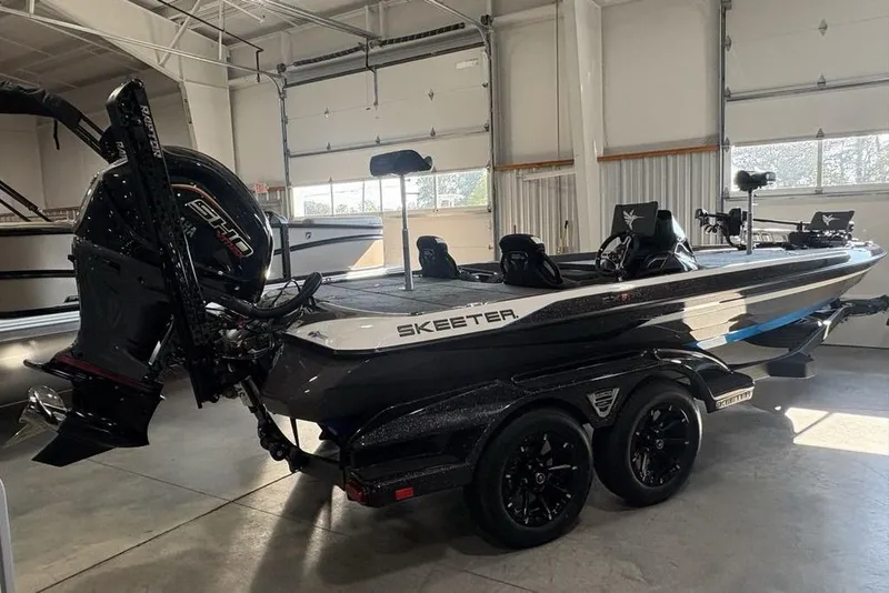 Slide: The Image of 2026 Skeeter FXR20 FLEX boat in showroom, featuring sleek design and powerful engine. - 6