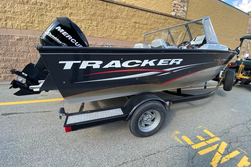 Slide: The Image of 2011 Tracker Pro Guide V-175 Combo boat on trailer, featuring Mercury engine. - 3