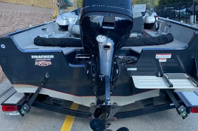 Slide: The Image of 2011 Tracker Pro Guide V-175 Combo boat with outboard motor, parked on trailer. - 4