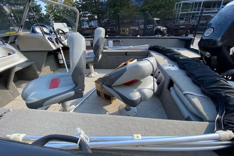 Slide: The Image of 2011 Tracker Pro Guide V-175 Combo boat interior with seating and controls. - 7