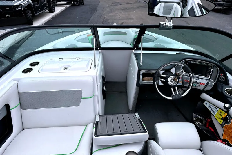 Slide: The Image of 2012 Nautique Sport Nautique 200 interior with sleek dashboard and comfortable seating. - 15