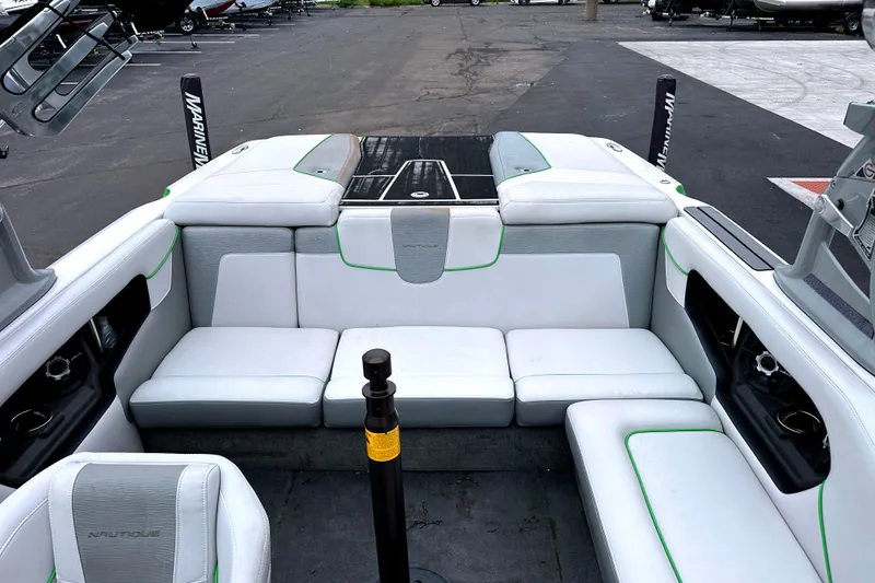Slide: The Image of 2012 Nautique Sport Nautique 200 boat interior with white and gray seating. - 16
