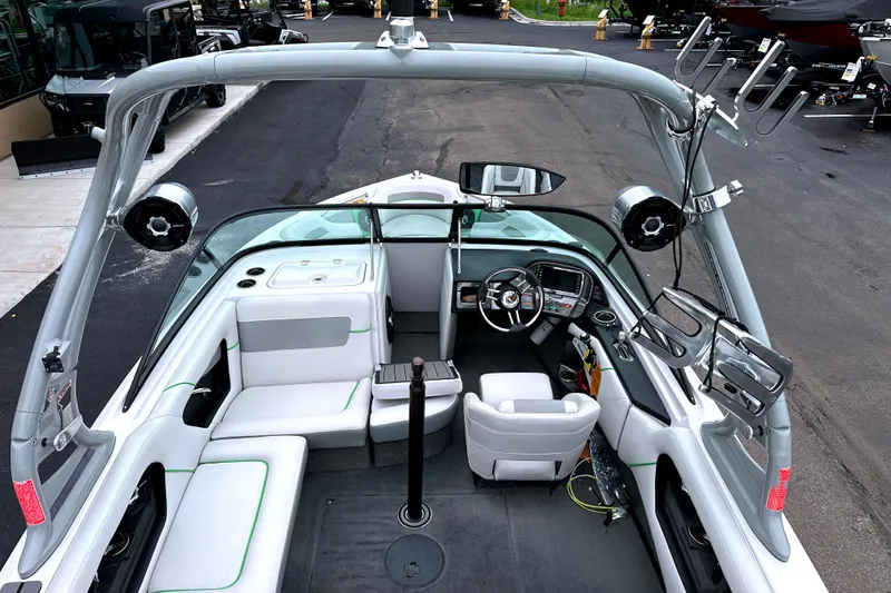 Slide: The Image of 2012 Nautique Sport Nautique 200 boat interior with seating and dashboard view. - 17