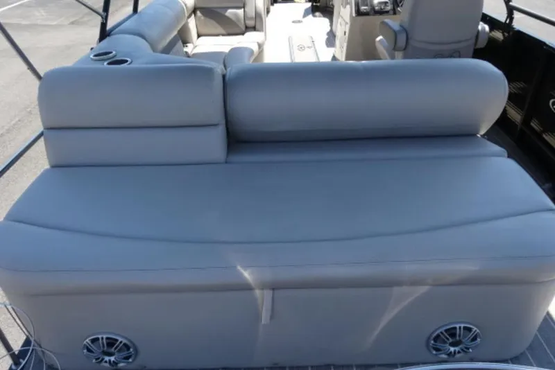 Slide: The Image of 2017 Harris Sunliner 240 boat interior with gray seating and cup holders. - 8