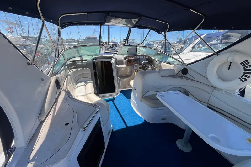 Slide: The Image of Interior of a 2005 Larson-Cabrio 370 boat with seating and navigation area. - 11