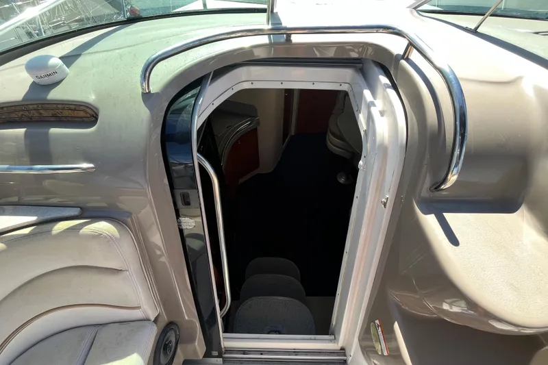 Slide: The Image of 2005 Larson-Cabrio 370 boat interior entrance with sleek design and chrome accents. - 19