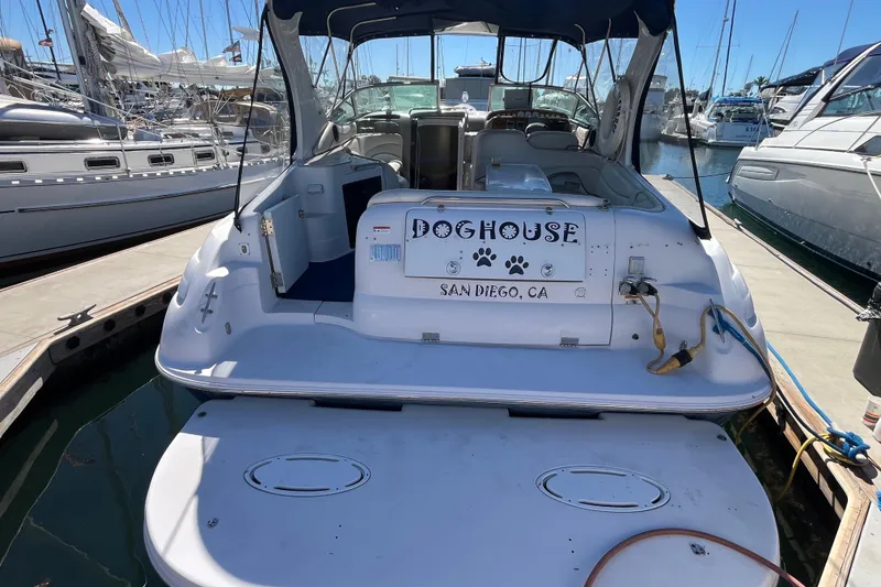 Slide: The Image of 2005 Larson-Cabrio 370 boat named "Doghouse" docked in San Diego marina. - 3