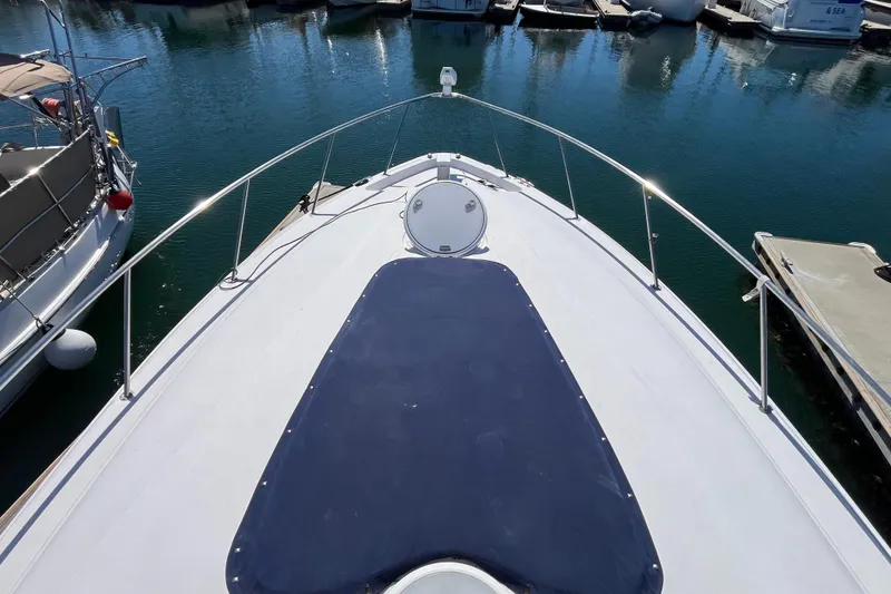 Slide: The Image of Bow view of 2005 Larson-Cabrio 370 yacht docked in marina. - 7