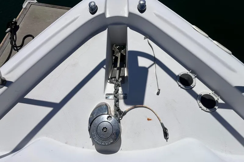 Slide: The Image of Bow of 2005 Larson-Cabrio 370 boat with anchor chain and winch system. - 8