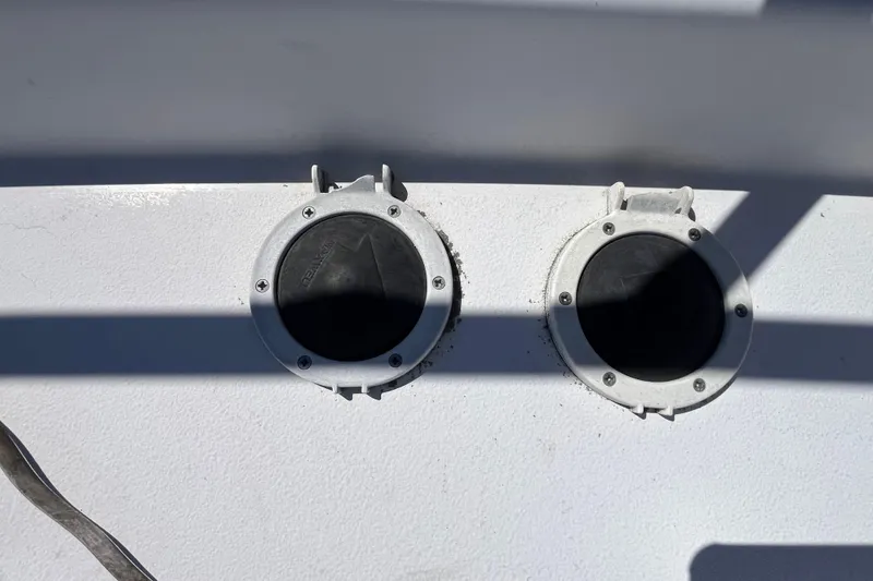 Slide: The Image of Two circular hatches on a 2005 Larson-Cabrio 370 boat deck. - 9