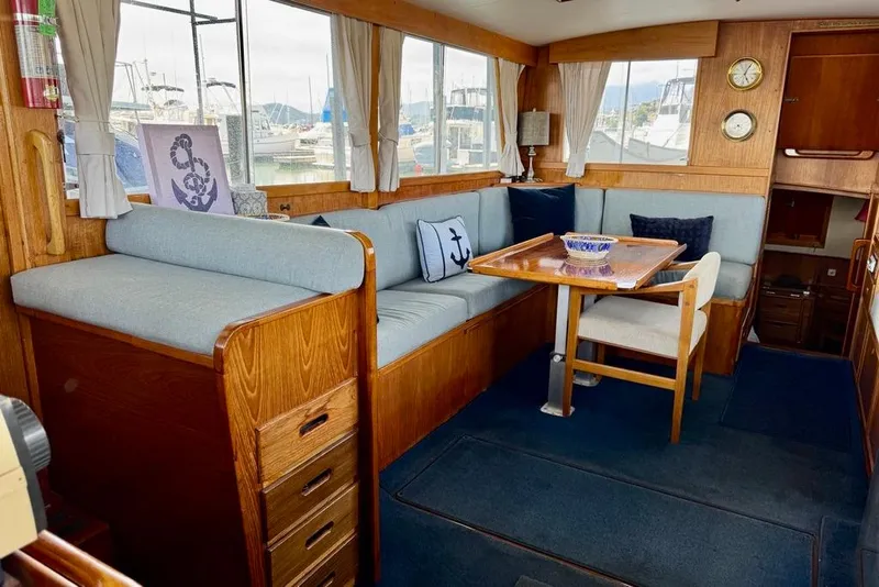 Slide: The Image of Interior of a 1978 Grand Banks Classic yacht with wooden furnishings and nautical decor. - 23