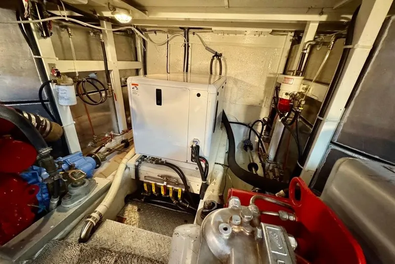 Slide: The Image of Engine room of a 1978 Grand Banks Classic boat, showcasing machinery and equipment. - 39