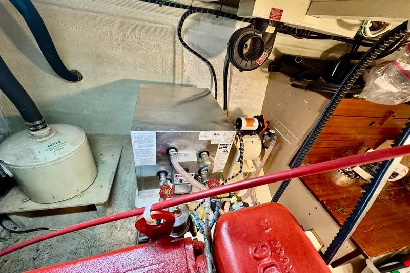 Slide: The Image of Engine room of 1978 Grand Banks Classic boat with mechanical components. - 40