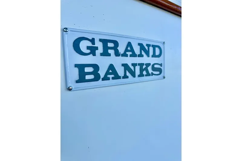 Slide: The Image of 1978 Grand Banks Classic boat nameplate on white background. - 75