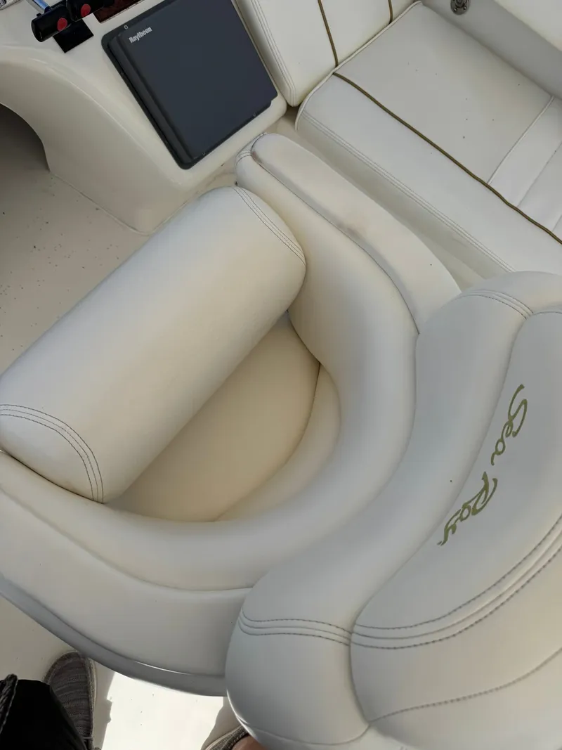 Slide: The Image of Luxurious helm of a 1999 Sea Ray 420 Aft Cabin yacht with marina view. - 4