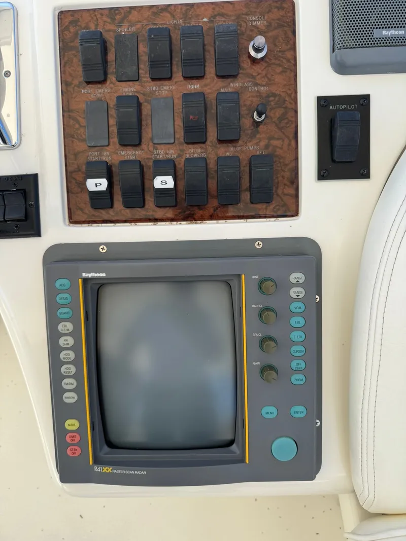 Slide: The Image of Luxurious 1999 Sea Ray 420 Aft Cabin bedroom with elegant decor and cozy bedding. - 7