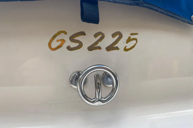 Slide: The Image of 1998 Glastron/Carlson GS225 boat detail with chrome handle and model number. - 4