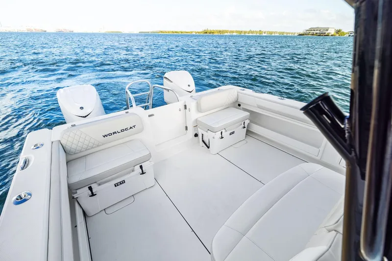 Slide: The Image of 2026 World Cat 325CC boat interior with seating and ocean view. - 13