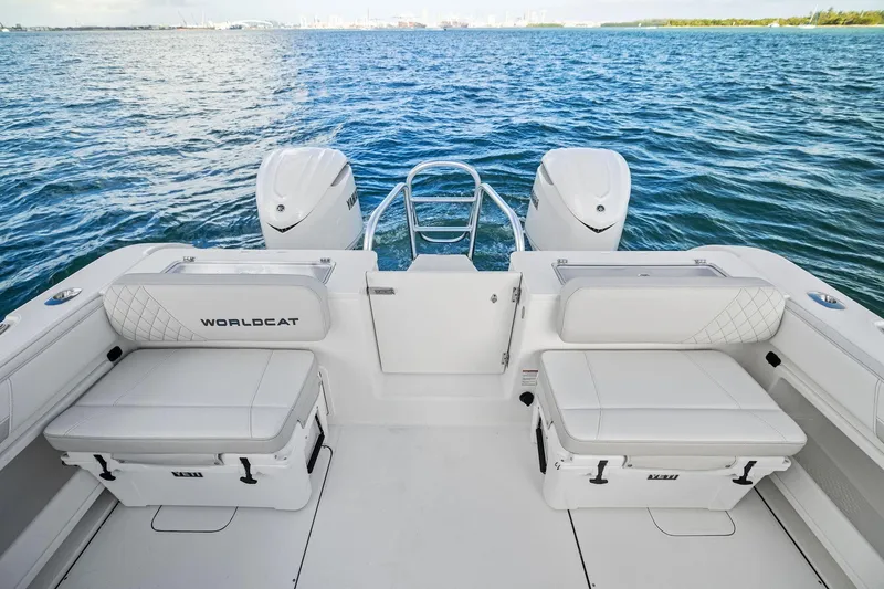 Slide: The Image of 2026 World Cat 325CC boat interior with dual engines on open water. - 16