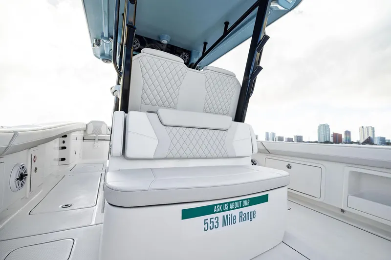 Slide: The Image of 2026 World Cat 325CC boat interior with luxurious seating and 553-mile range feature. - 17