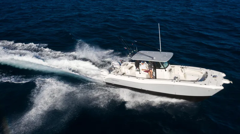 Slide: The Image of 2026 World Cat 325CC cruising on open ocean waters. - 7