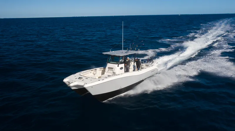 Slide: The Image of 2026 World Cat 325CC cruising swiftly on open ocean waters. - 8