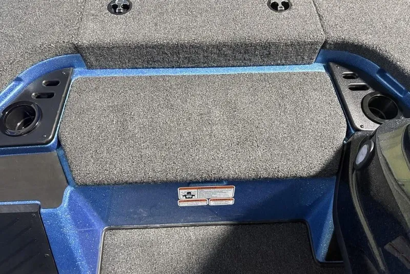 Slide: The Image of Carpeted deck of 2026 Nitro Z18 Pro boat with cup holders and storage compartments. - 16