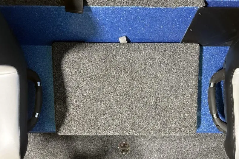 Slide: The Image of Interior of 2026 Nitro Z18 Pro boat with gray and blue carpeted flooring. - 19