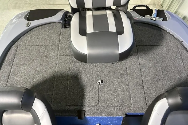 Slide: The Image of 2026 Nitro Z18 Pro boat interior with gray carpet and black-and-white seating. - 24